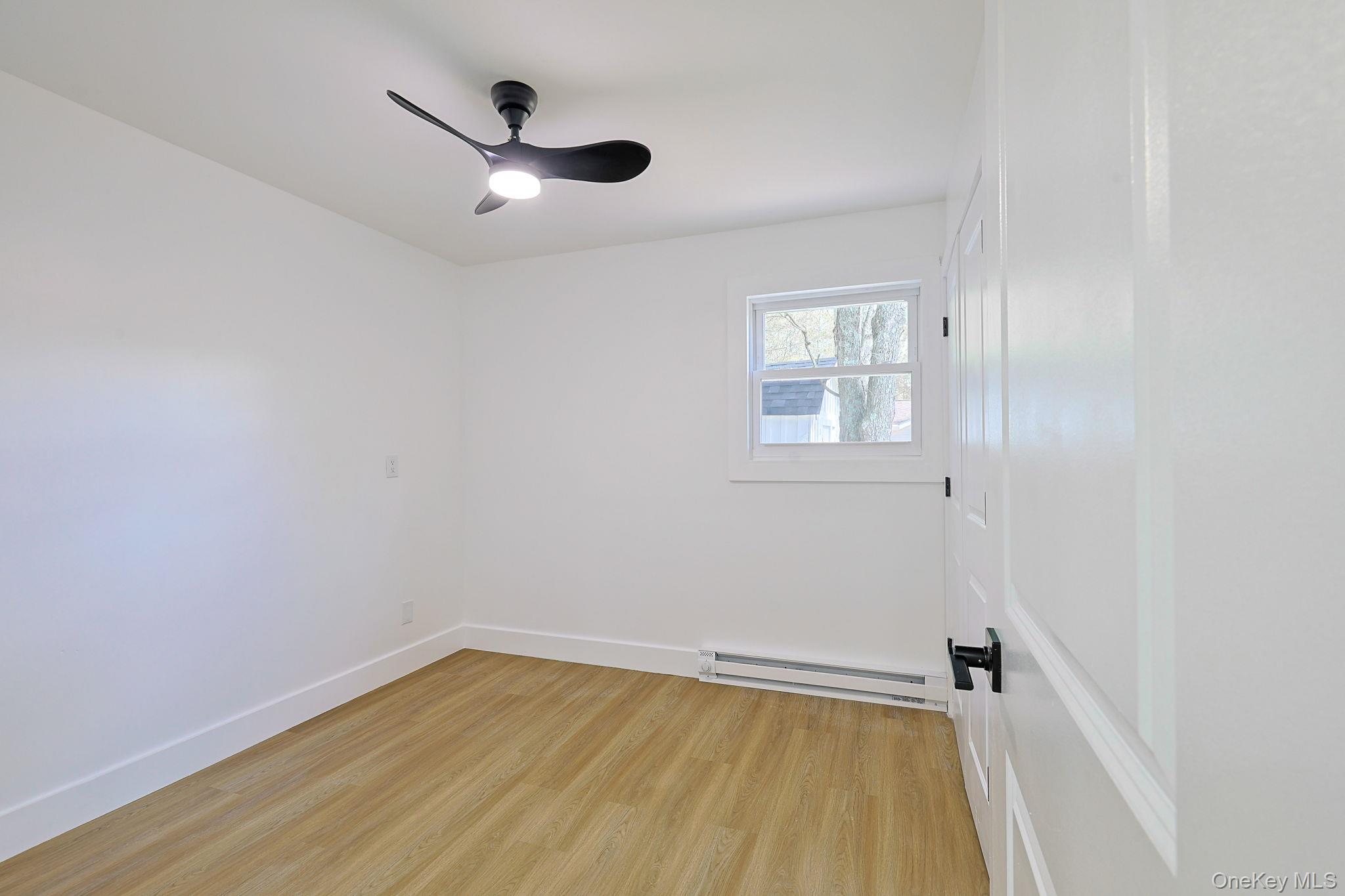 25 Overlook Road Woodbourne, NY 12788 - Photo 12 of 22 wooden floor in an empty room with a window