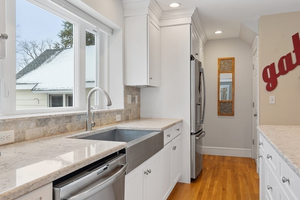 212 Hawthorne Lane Concord, MA 01742 - Photo 13 of 41 a kitchen with a sink stove and refrigerator