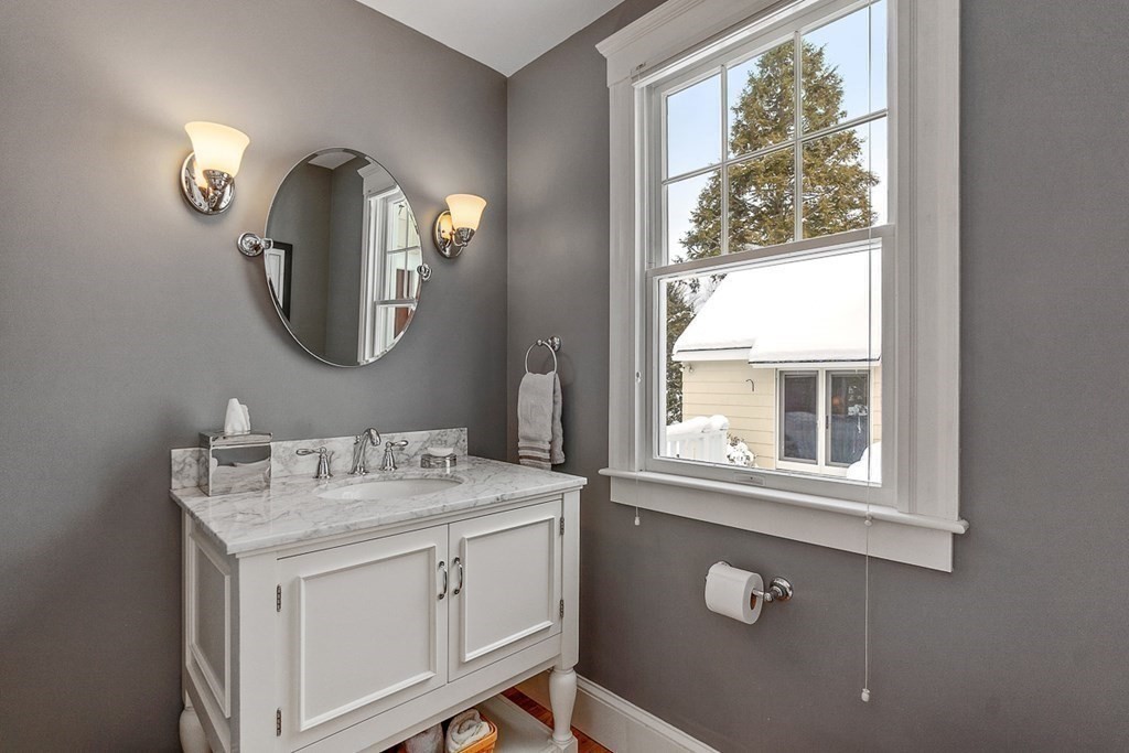 212 Hawthorne Lane Concord, MA 01742 - Photo 15 of 41 a bathroom with a sink and a mirror
