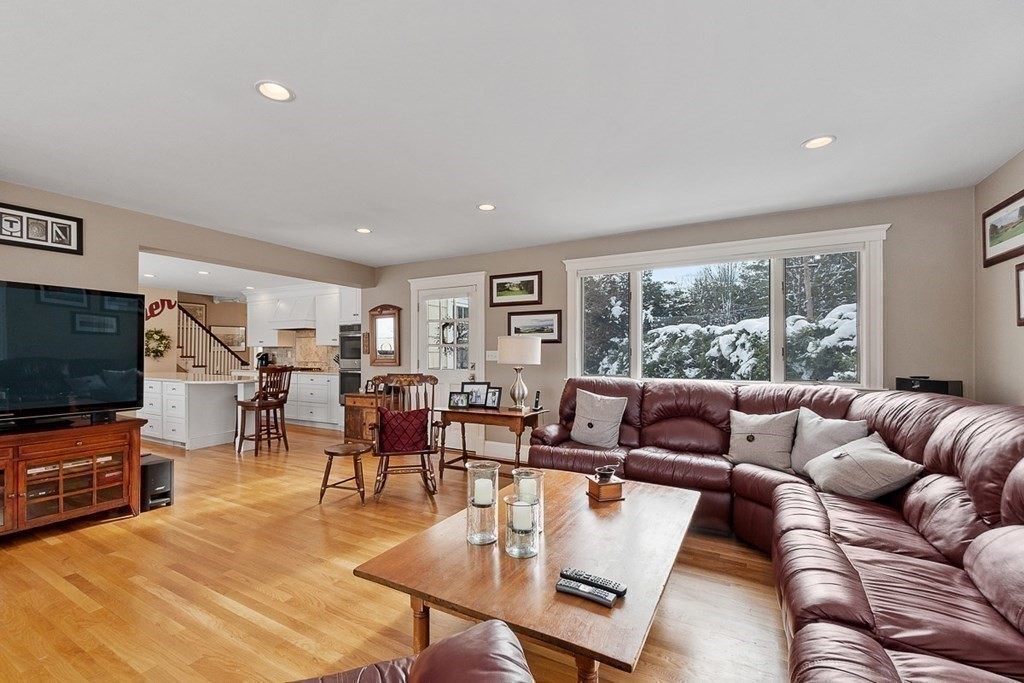 212 Hawthorne Lane Concord, MA 01742 - Photo 17 of 41 a living room with furniture and a flat screen tv