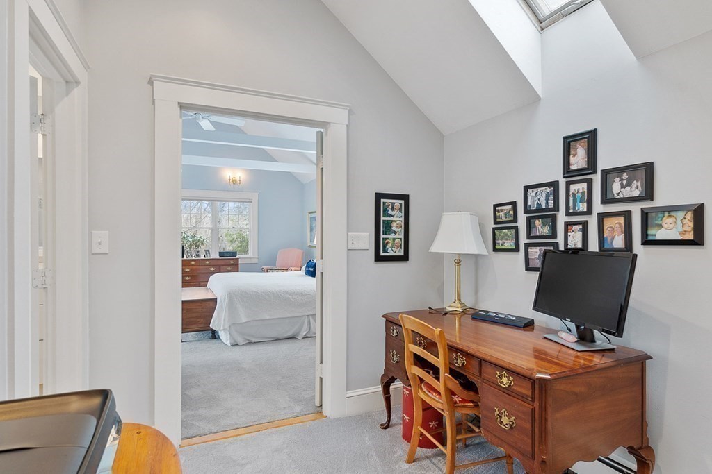 212 Hawthorne Lane Concord, MA 01742 - Photo 19 of 41 a view of a workspace with a bookshelf