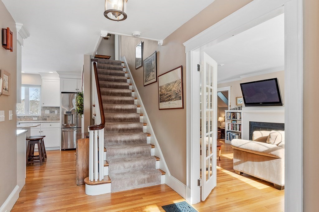 212 Hawthorne Lane Concord, MA 01742 - Photo 2 of 41 a view of entryway and hall with wooden floor