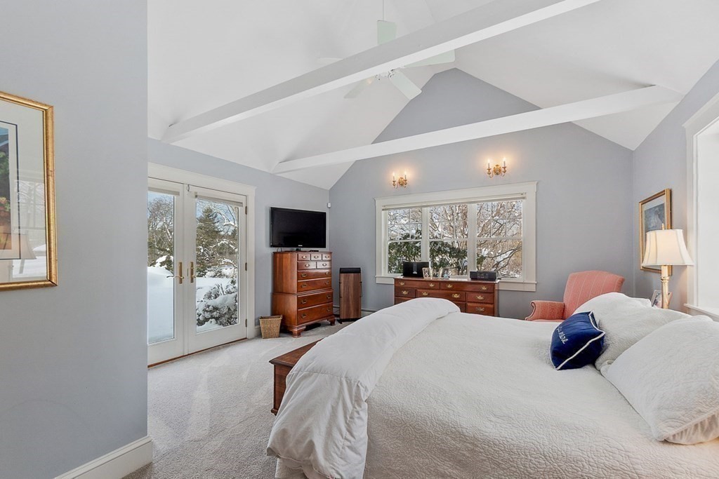 212 Hawthorne Lane Concord, MA 01742 - Photo 21 of 41 a bedroom with bed a large window and tv