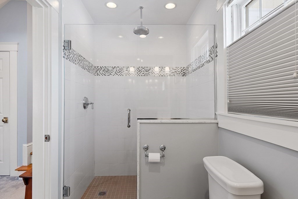 212 Hawthorne Lane Concord, MA 01742 - Photo 23 of 41 a bathroom with a shower a toilet and sink