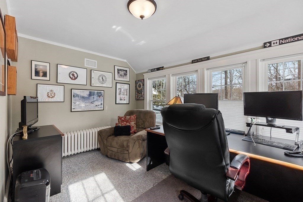 212 Hawthorne Lane Concord, MA 01742 - Photo 24 of 41 a living room with furniture and a flat screen tv