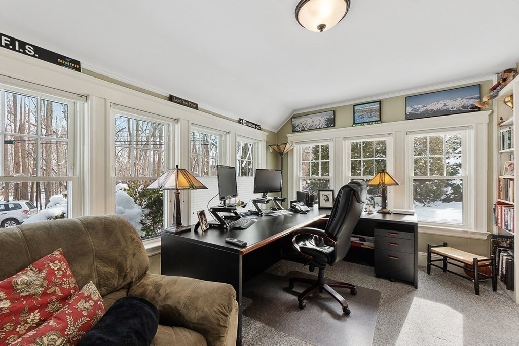 212 Hawthorne Lane Concord, MA 01742 - Photo 25 of 41 a living room with furniture fireplace and a large window