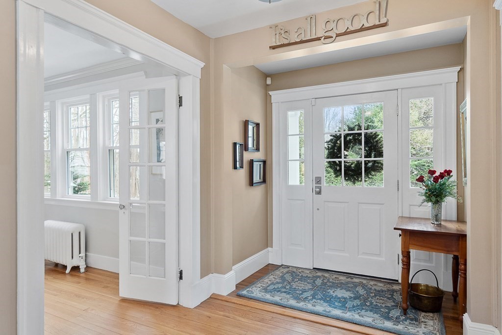 212 Hawthorne Lane Concord, MA 01742 - Photo 3 of 41 a view of livingroom with furniture window and wooden floor