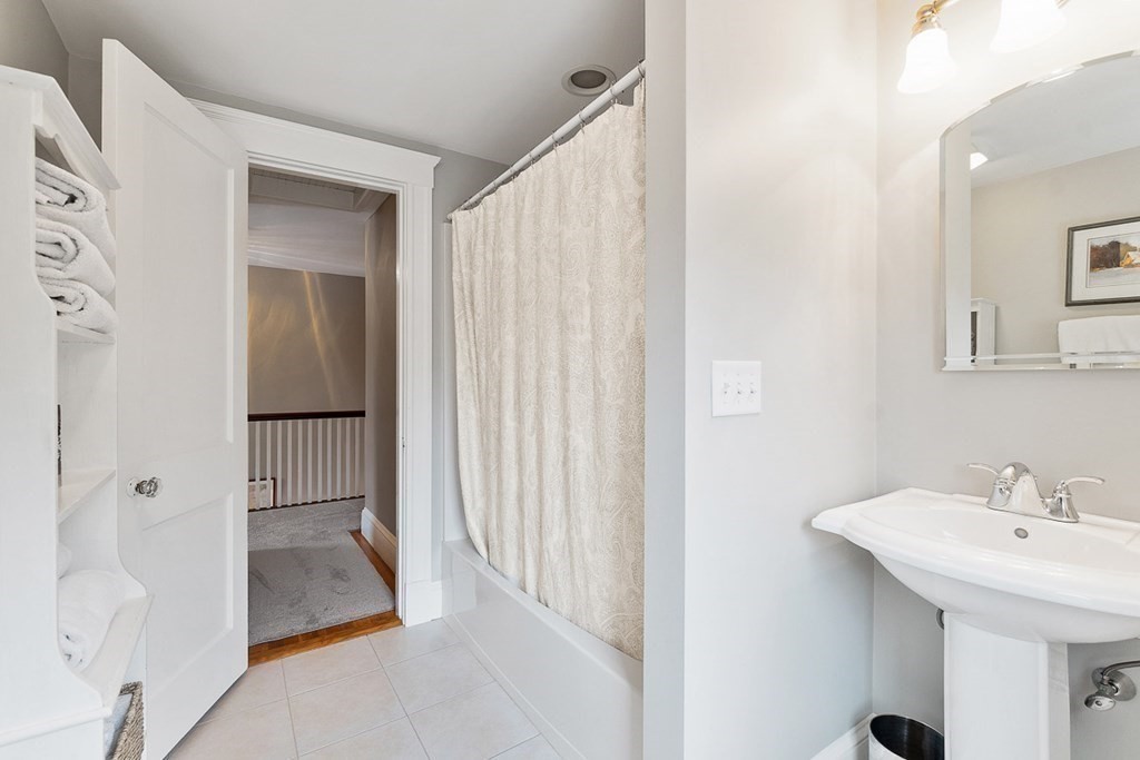212 Hawthorne Lane Concord, MA 01742 - Photo 31 of 41 a bathroom with a sink and a mirror