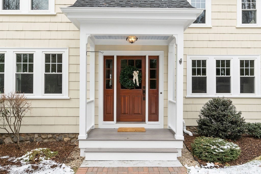 212 Hawthorne Lane Concord, MA 01742 - Photo 33 of 41 a front view of a house with a garden