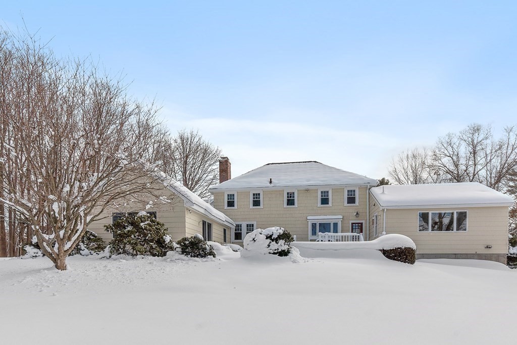 212 Hawthorne Lane Concord, MA 01742 - Photo 34 of 41 a front view of a house with a yard covered in snow