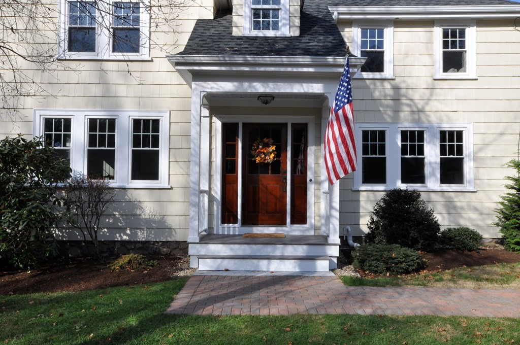 212 Hawthorne Lane Concord, MA 01742 - Photo 41 of 41 a front view of a house with garden