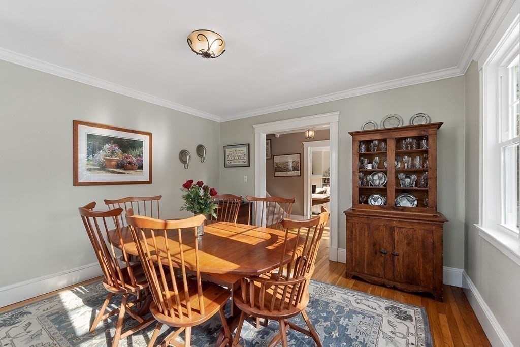 212 Hawthorne Lane Concord, MA 01742 - Photo 8 of 41 a view of a dining room with furniture and wooden floor