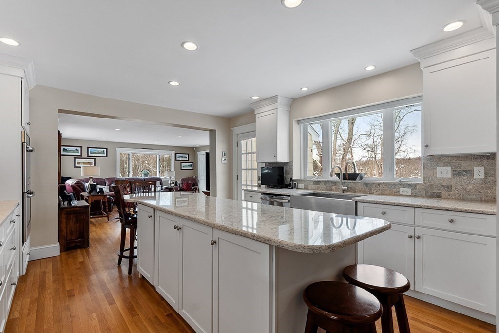 212 Hawthorne Lane Concord, MA 01742 - Photo 10 of 41 a kitchen with lots of counter top space and dining table