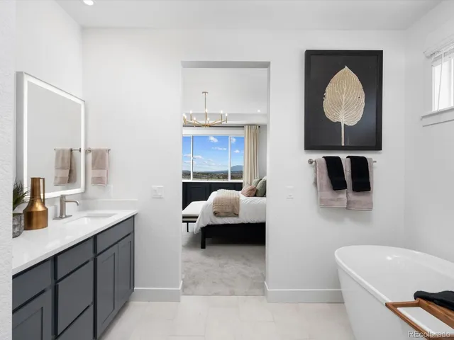 a en suite bathroom with a toilet sink and mirror