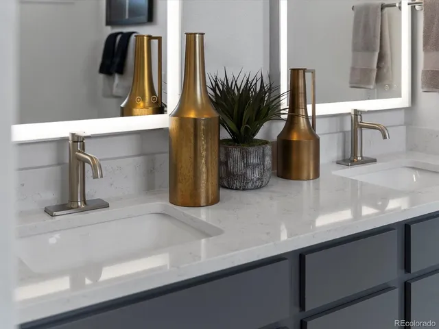 a kitchen with a sink and a potted plant