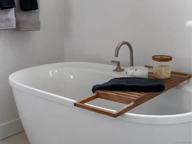 a white bath tub sitting in a bathroom