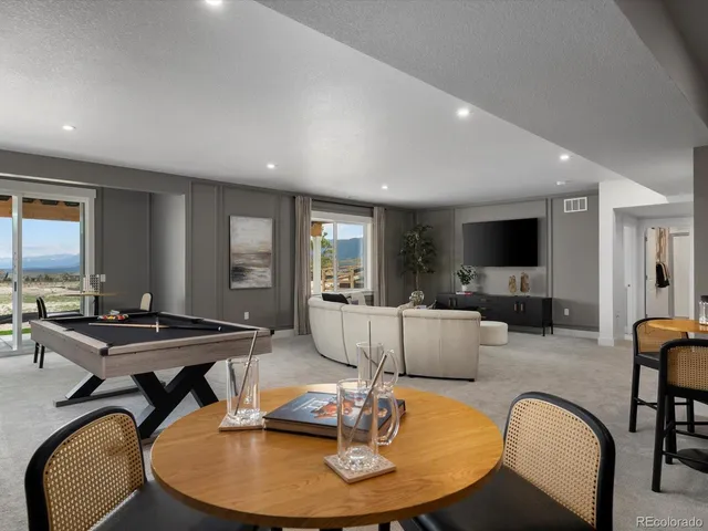 a dining room with furniture and window