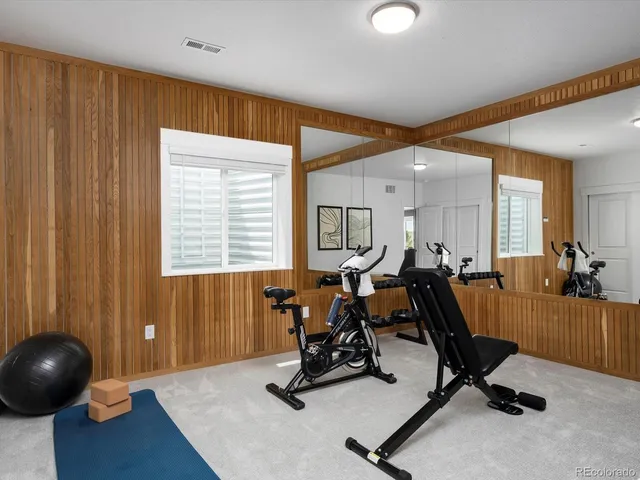 a view of a workspace with furniture and windows