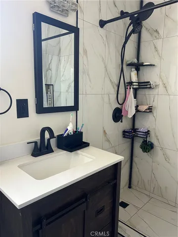 a kitchen with a sink cabinets and a table