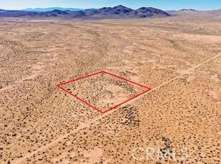 a view of wooden floor and a mountain view