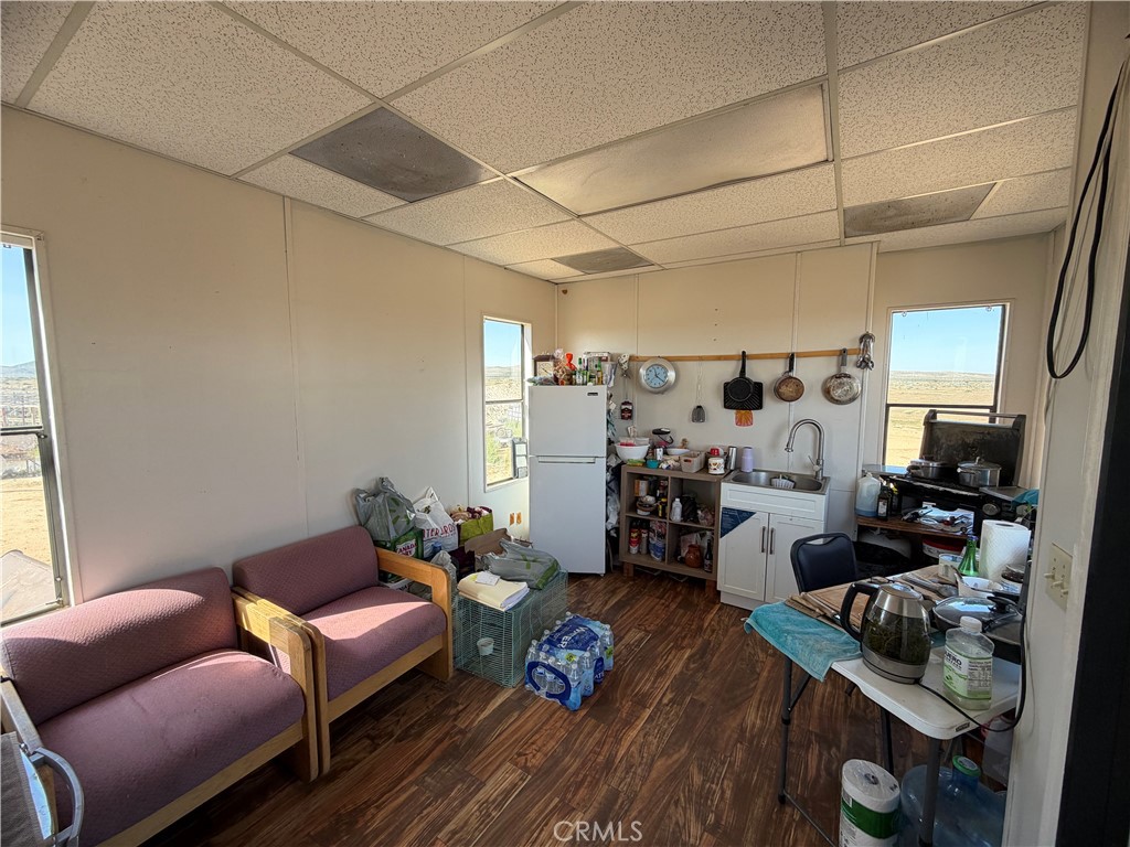 21353 Riverview Road Barstow, CA 92311 - Photo 15 of 24 a living room with furniture and a wooden floor