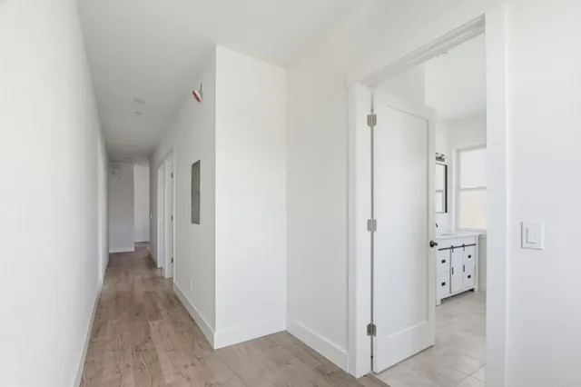 a view of a hallway with white walls