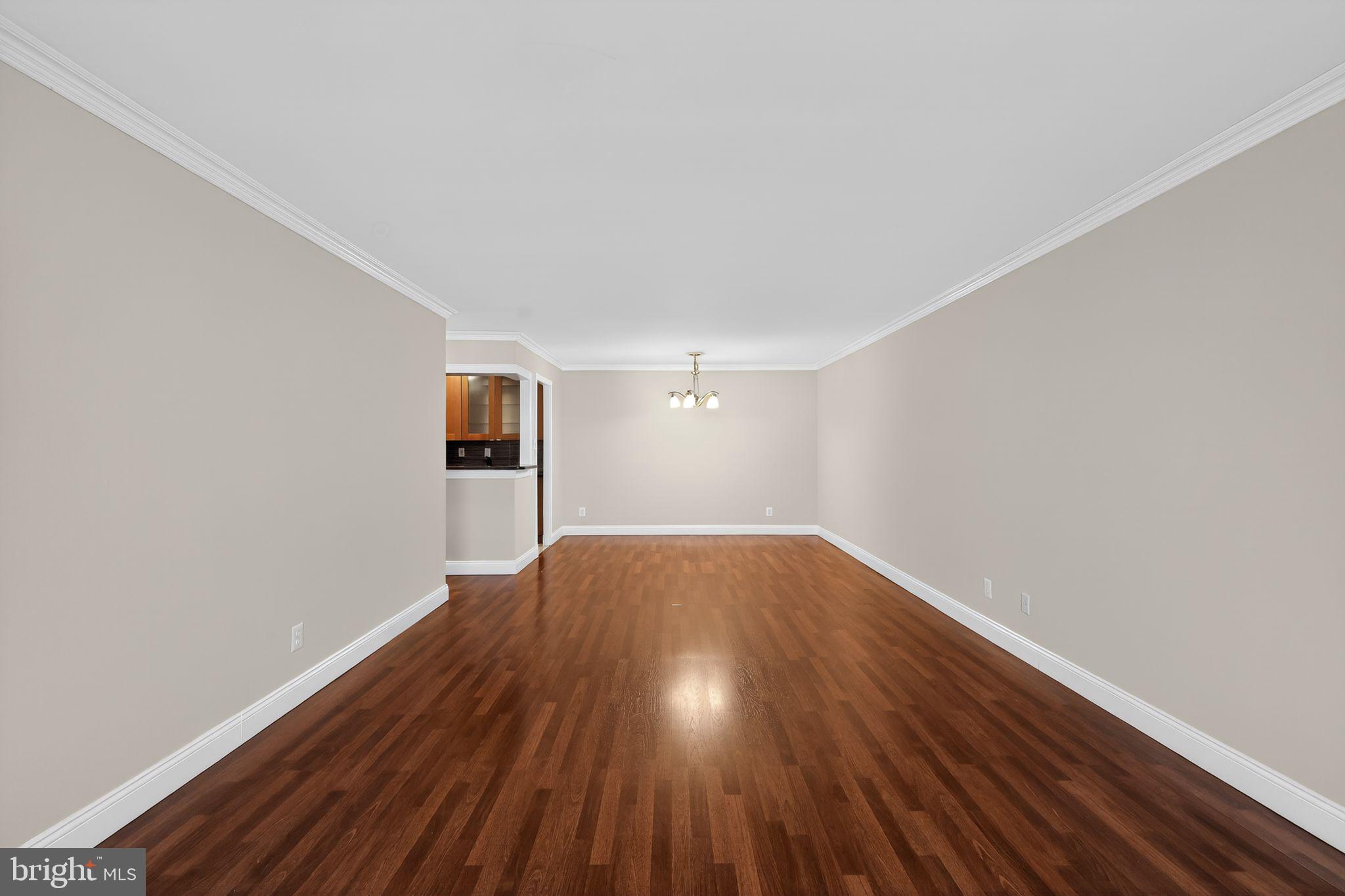 9701 Fields Road, Unit 1904 Gaithersburg, MD 20878 - Photo 13 of 31 a view of empty room with wooden floor