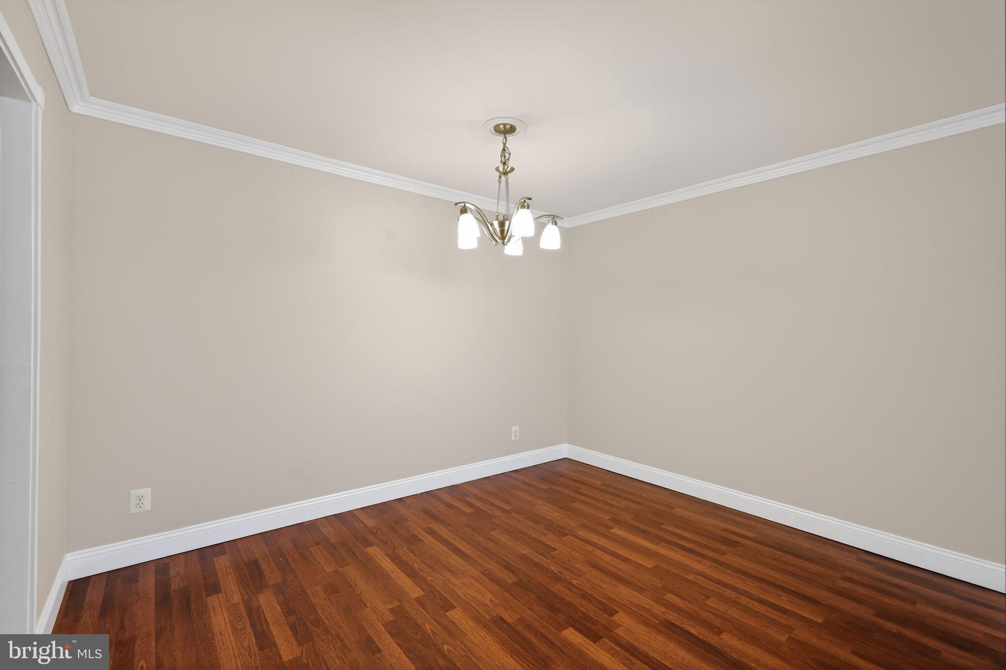 9701 Fields Road, Unit 1904 Gaithersburg, MD 20878 - Photo 14 of 31 wooden floor in an empty room
