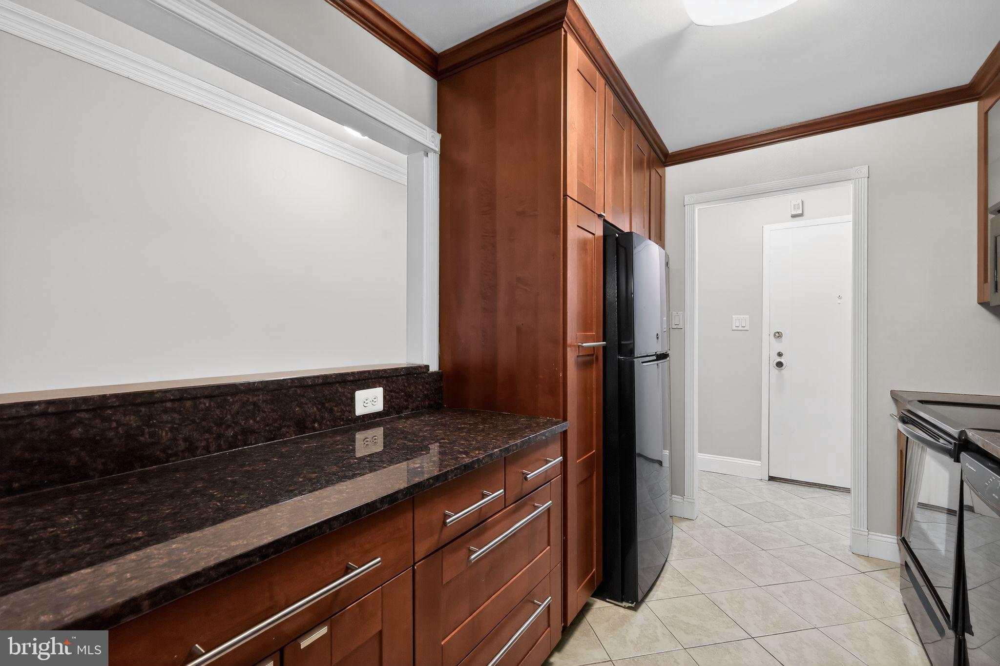 9701 Fields Road, Unit 1904 Gaithersburg, MD 20878 - Photo 20 of 31 a bathroom with a double vanity sink and mirror
