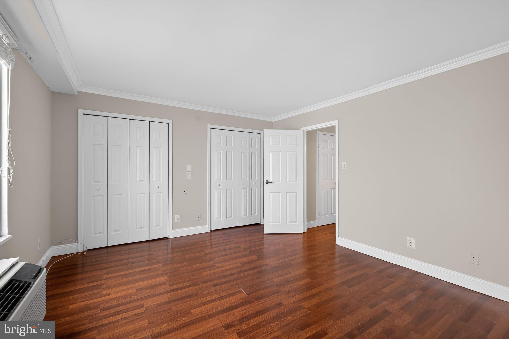 9701 Fields Road, Unit 1904 Gaithersburg, MD 20878 - Photo 22 of 31 a view of an empty room with wooden floor