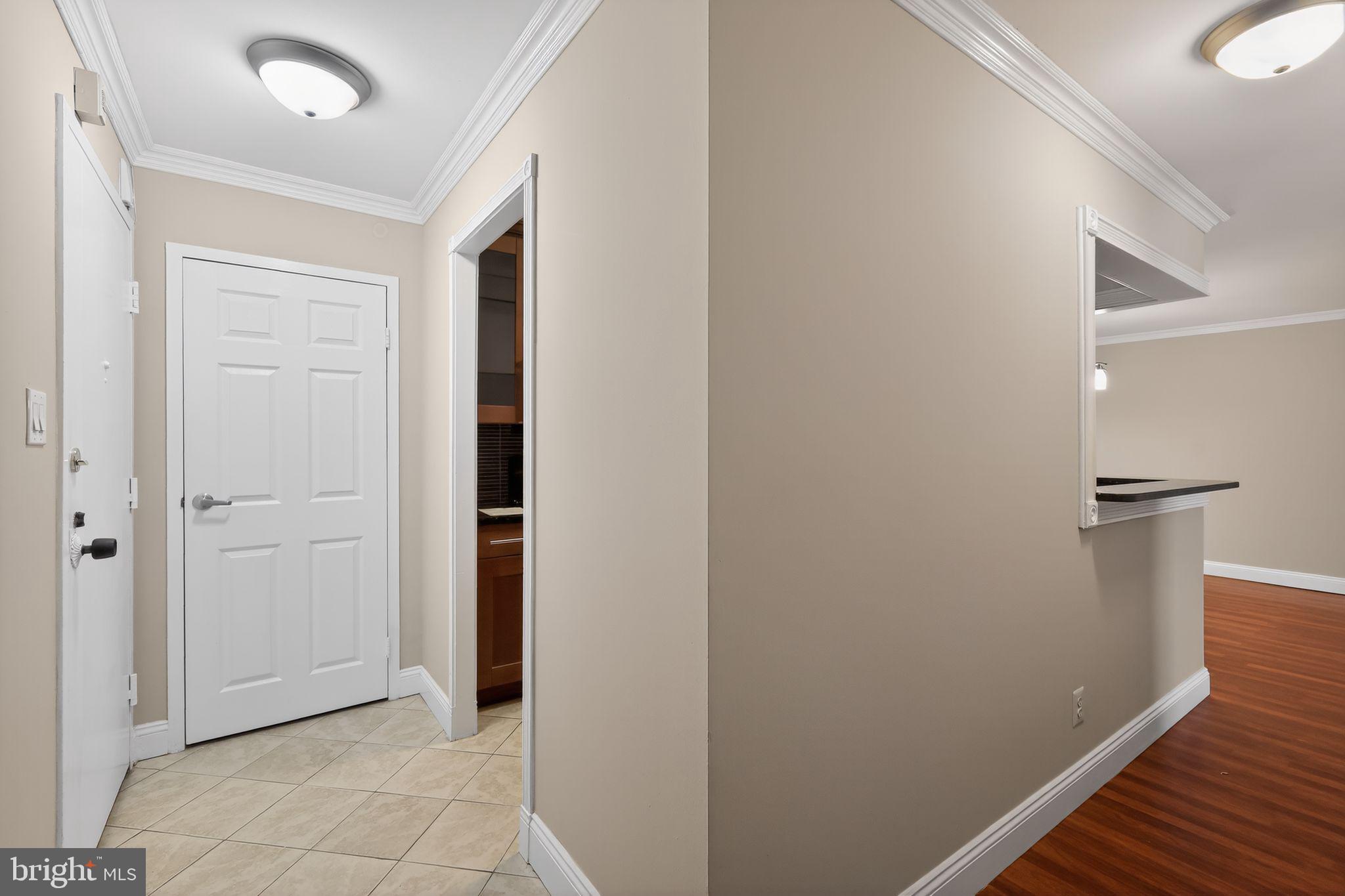 9701 Fields Road, Unit 1904 Gaithersburg, MD 20878 - Photo 29 of 31 a view of a hallway with wooden floor