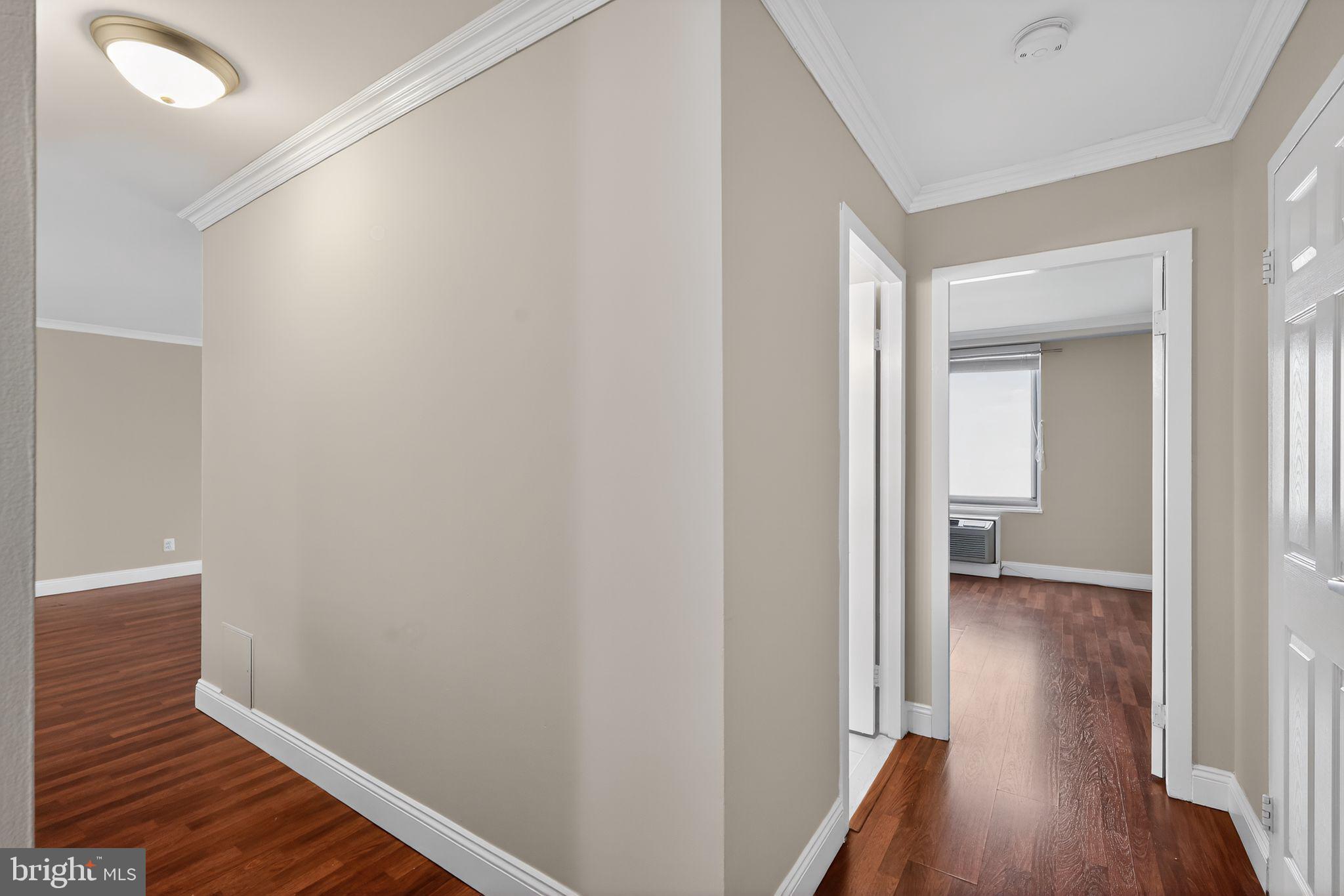 9701 Fields Road, Unit 1904 Gaithersburg, MD 20878 - Photo 30 of 31 a view of a hallway with wooden floor