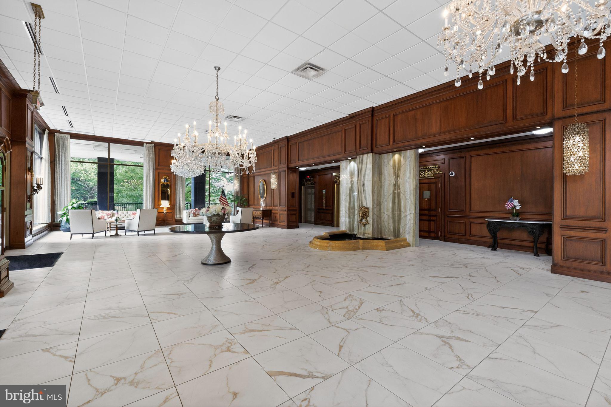 9701 Fields Road, Unit 1904 Gaithersburg, MD 20878 - Photo 6 of 31 a view of a lobby with furniture and chandelier