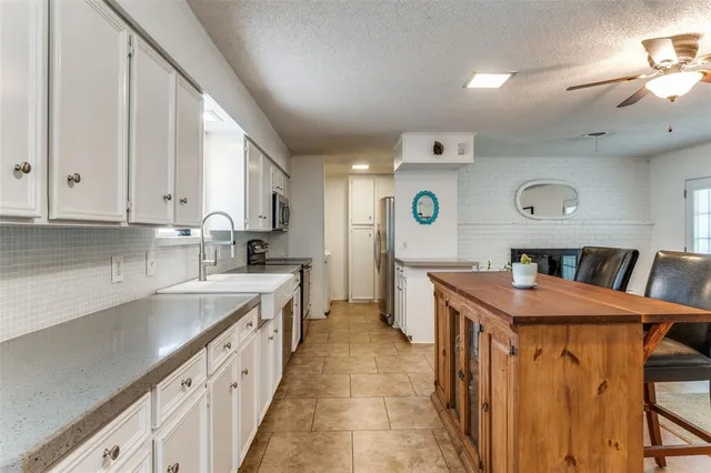a living room with furniture a dining table and kitchen view