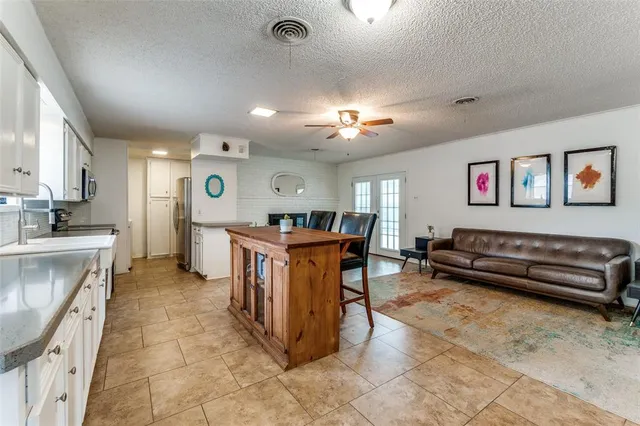 a view of a kitchen with furniture and a window