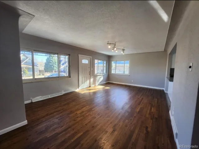 a kitchen with kitchen island a counter top space a sink and stainless steel appliances