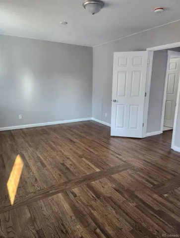 a view of entryway with stairs and wooden floor