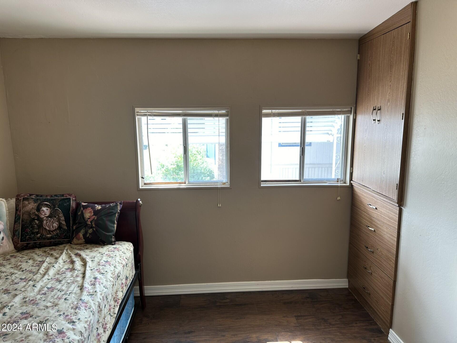 2460 East Main Street, Unit G3 Mesa, AZ 85213 - Photo 11 of 25 a bedroom with a bed and window