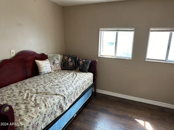 a bedroom with a bed and window
