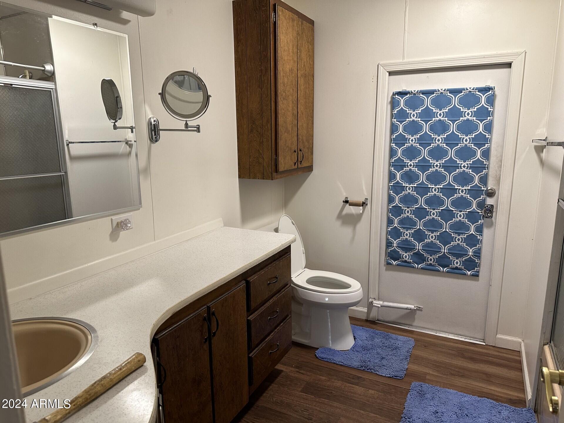 2460 East Main Street, Unit G3 Mesa, AZ 85213 - Photo 14 of 25 a bathroom with a sink a toilet and shower