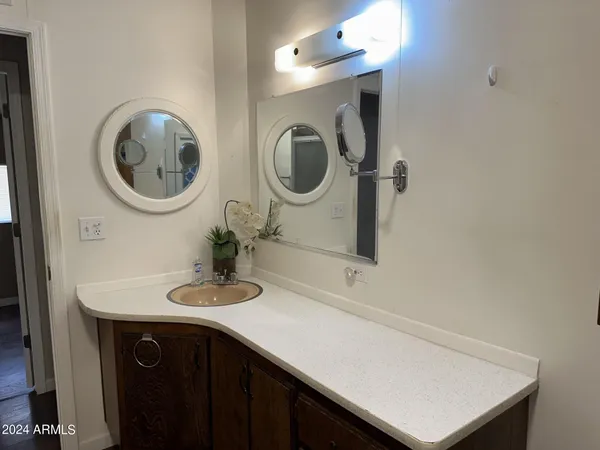 a bathroom with a sink and a mirror