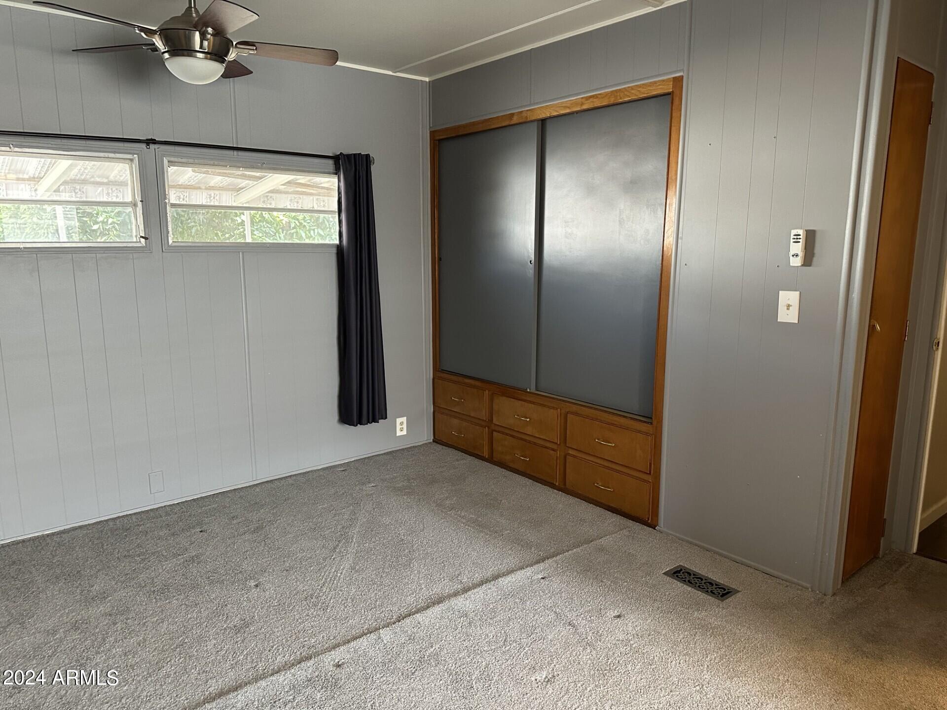 2460 East Main Street, Unit G3 Mesa, AZ 85213 - Photo 22 of 25 an empty room with windows