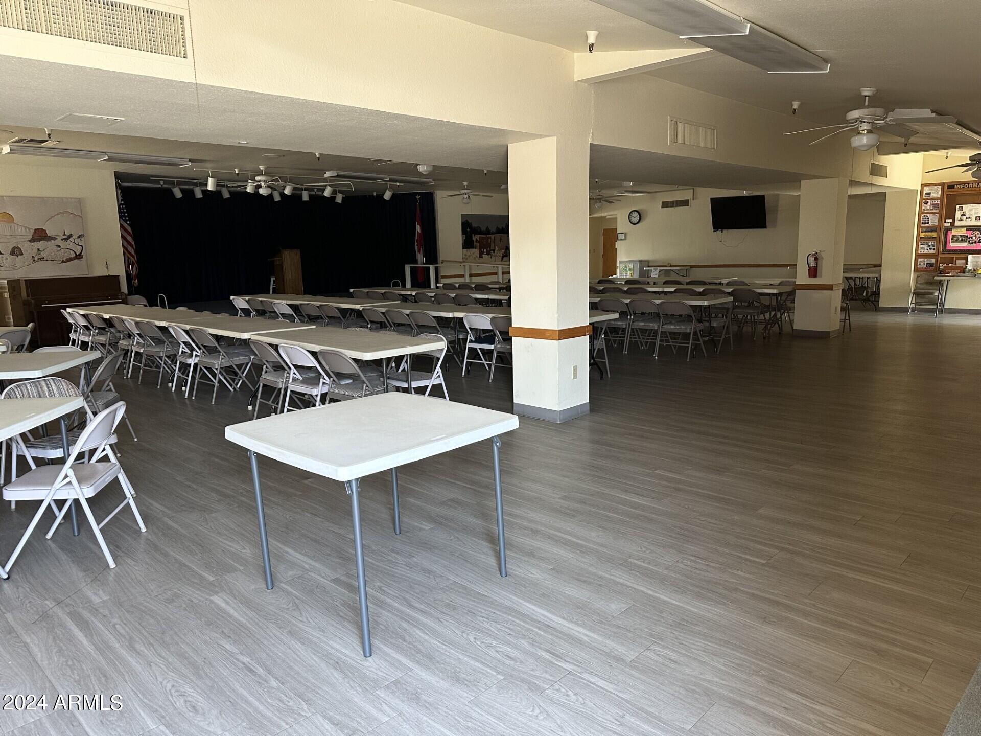 2460 East Main Street, Unit G3 Mesa, AZ 85213 - Photo 25 of 25 a living room with furniture and a wooden floor