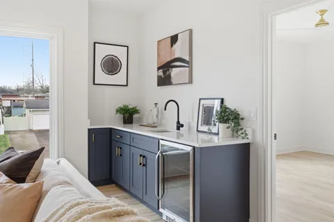 a bedroom with a bed and a potted plant