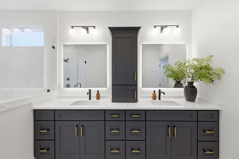 a bathroom with a double vanity sink and a mirror