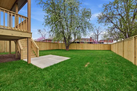 a view of backyard with house