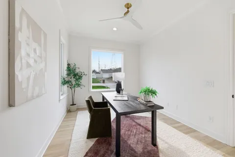 a dining room with furniture and window