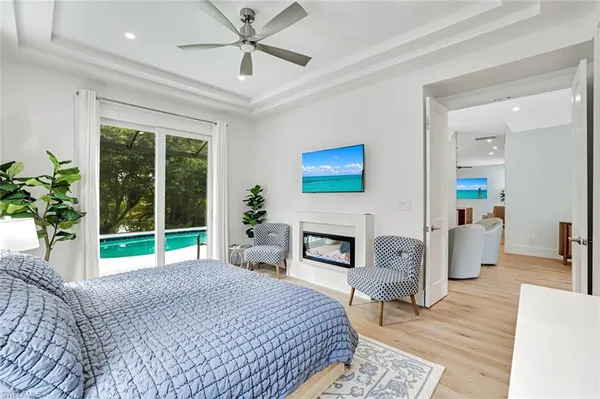 a bedroom with a bed and a fireplace