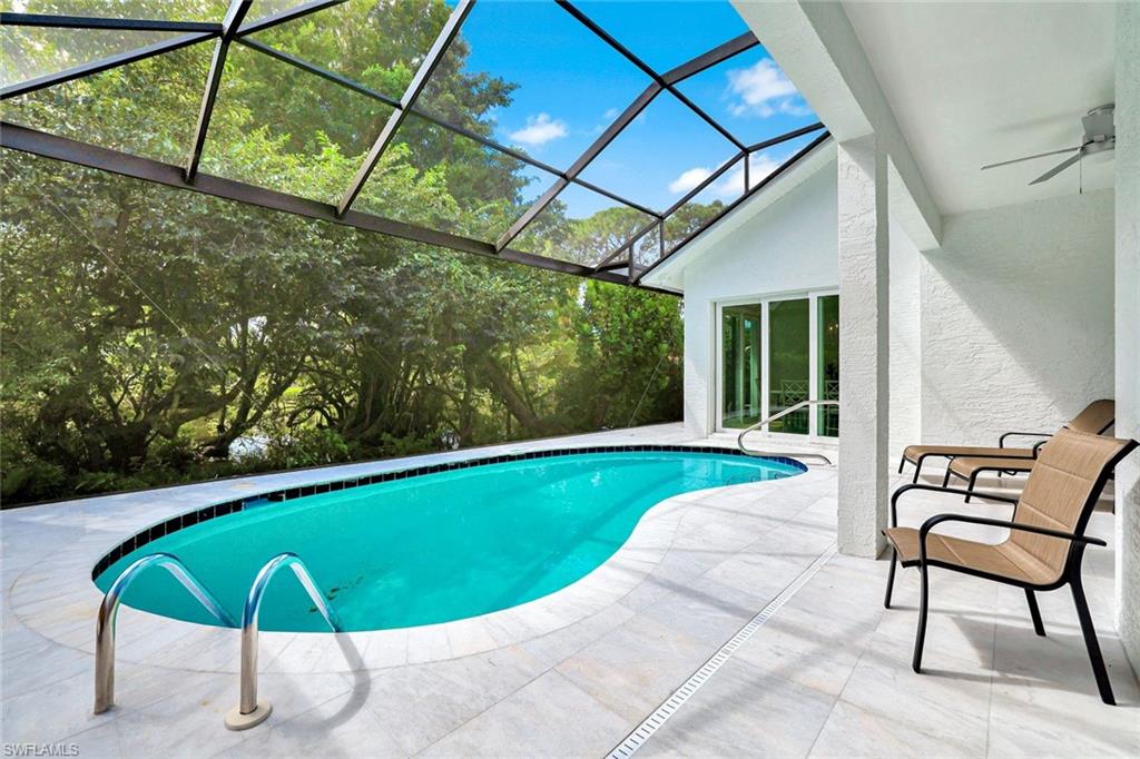 2515 Royal Palm Court Naples, FL 34103 - Photo 2 of 32 a view of a chairs and table in the patio