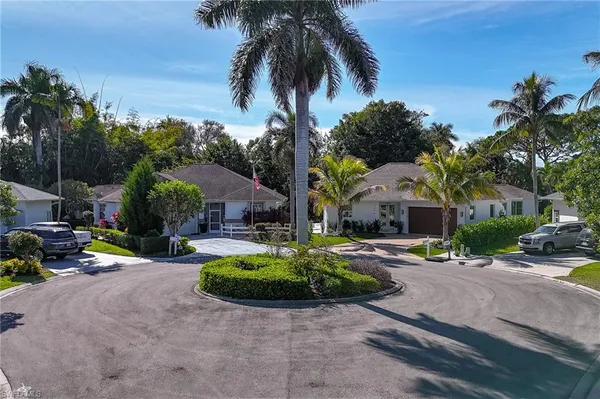 an aerial view of a house with a yard and garden